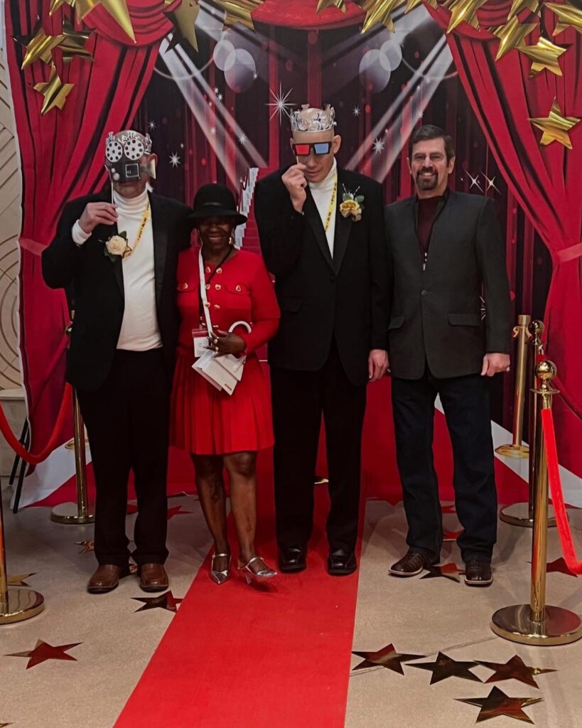 disabled people taking a picture on a red carpet event